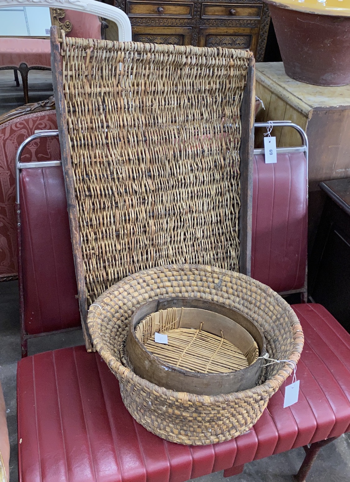 A rectangular African woven hardwood tray, two sieves and a woven bowl